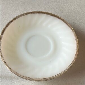Vintage Fire King Saucers. White swirl design with gold trim.